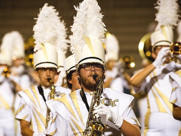 Customized marching band uniform, gold and white with large feather in hat