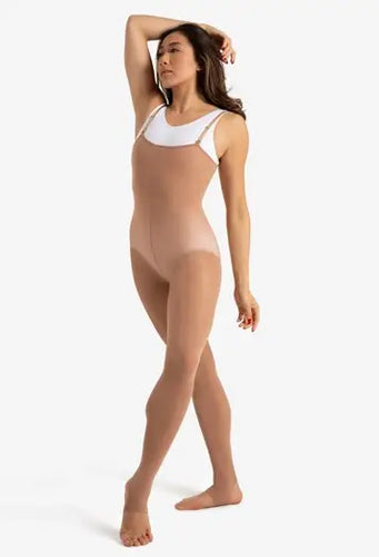 Full-length front view of Capezio women’s stirrup body tight in nude tone, featuring a sleek fitted design with adjustable shoulder straps and open stirrup feet, ideal for ballet, contemporary dance, rehearsals, and stage performances.