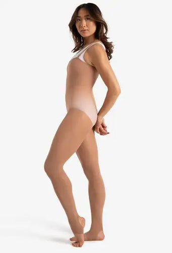 Side view of Capezio women’s stirrup body tight in nude shade, showcasing a smooth, form-fitting silhouette with supportive shoulder straps and flexible stirrup feet, designed for ballet, contemporary dance, rehearsals, and professional stage wear.