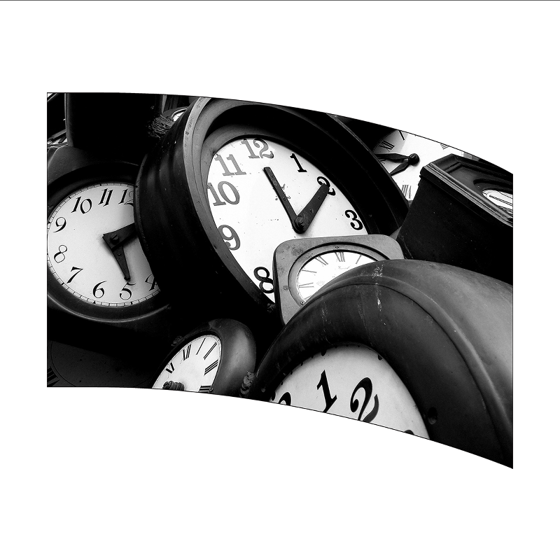 Black and white photo of multiple clocks showing different times.