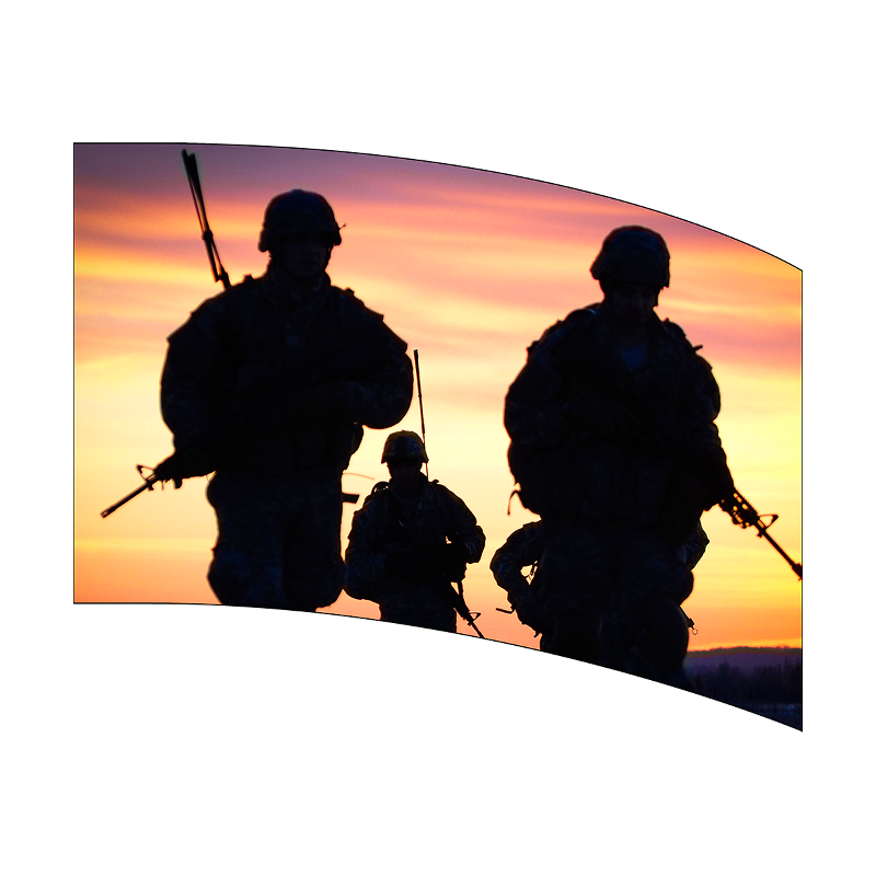 Silhouettes of soldiers against a sunset sky