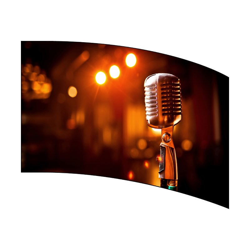 Vintage-style microphone with a blurred background of lights