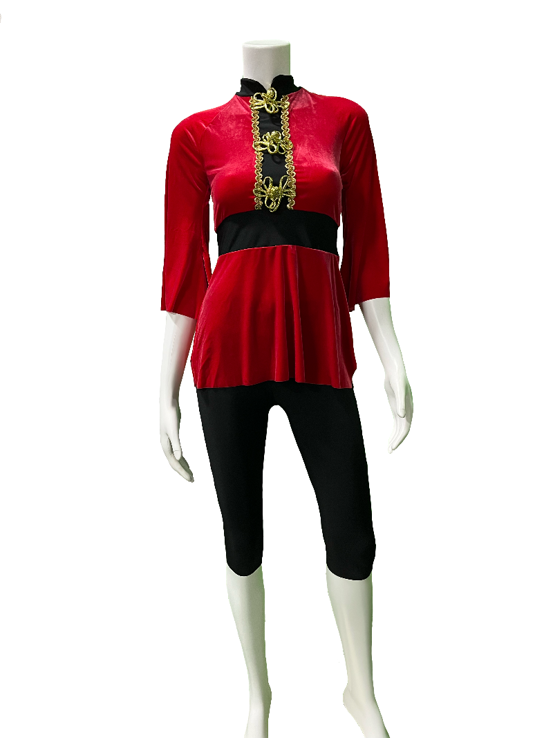 Red top with black accents on a mannequin against a white background