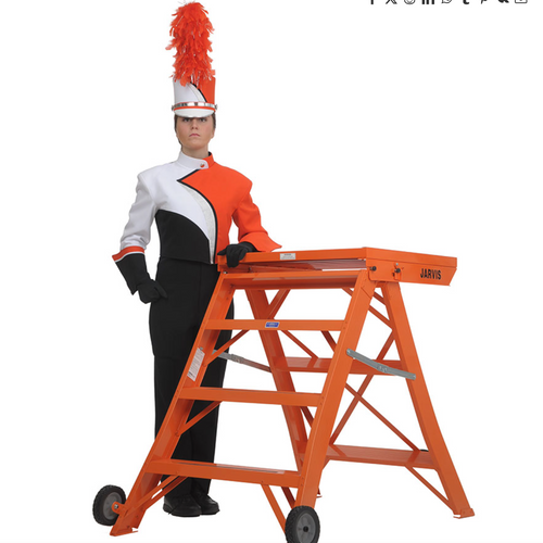 Jarvis 42-inch Podium Model 7 shown with a drum major in full marching band uniform, featuring an orange aluminum conducting podium with wide platform, sturdy steps, and wheeled base—ideal for marching band performances and field conducting.