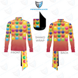 Front and back views of a long-sleeve athletic top with a colorful polka dot pattern over a yellow-to-pink gradient, shown with a matching neck gaiter and a black shako wrap insert on a white background with a shield logo.