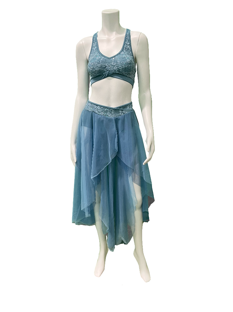 A mannequin wearing a light blue two-piece costume with lace detailing. The outfit includes a racer-back top and a flowing mesh skirt with a lace waistband.