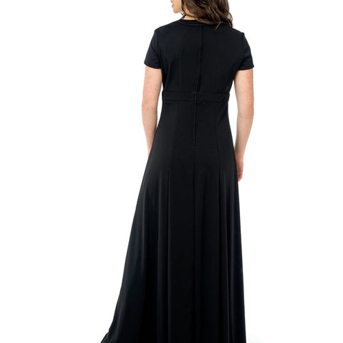 Back view of the Savannah crew V-notch neck short sleeve black dress, showcasing a fitted bodice, smooth waist seam, and flowing full-length skirt, styled for choir, performance, or formal event wear against a white background.