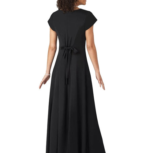Back view of the Pippa Cowl Neck Cap Sleeve Dress in black, showcasing cap sleeves, a waist tie detail, and a flowing floor-length silhouette, modeled against a clean white studio background.