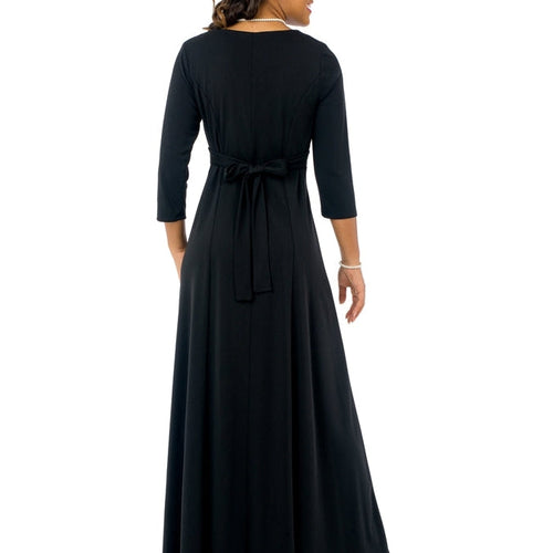 Back view of the Taylor Sweetheart Neckline 3/4 Sleeve Dress in black, featuring a fitted waist with self-tie belt, elegant 3/4 sleeves, and a flowing floor-length skirt, designed for formal occasions, stage performances, and elegant group ensembles.
