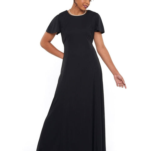 Jenna High Scoop Neck flutter sleeve dress in black, featuring a flowing full-length silhouette and soft drape, worn by a model for choir, show choir, and formal performance events.