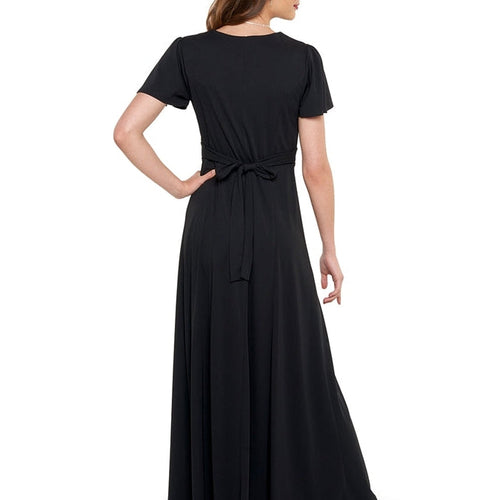 Back view of Clara heart-shaped neckline flutter sleeve dress in black, featuring a tie-back waist and flowing full-length skirt, highlighting the elegant fit and graceful silhouette of this formal performance dress.