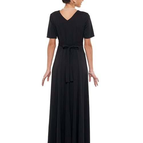 Back view of the Ophelia High Scoop Neck Short Sleeve Dress showcasing a floor-length black performance gown with a modest V-back detail, short sleeves, and a softly tied waist, designed for choir performances, concerts, recitals, and formal stage wear.