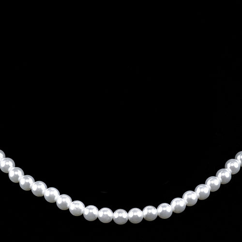 Classic strung pearl necklace featuring evenly sized white pearls on a black background, ideal for formal wear, choir and concert attire, recitals, weddings, and elegant stage performances.