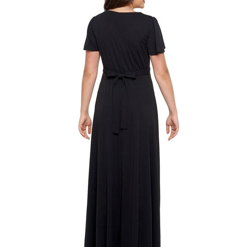 Back view of Remi cowl neck flutter sleeve dress in black, showcasing a softly draped silhouette, short flutter sleeves, adjustable waist tie, and flowing floor-length skirt, ideal for choir performances, formal events, and elegant stage wear.