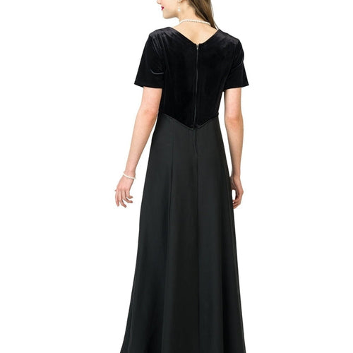 Back view of Julia velvet scoop neck short sleeve dress in black, showcasing a smooth velvet bodice, zip-back closure, and flowing full-length skirt, designed for choir performances, formal concerts, and elegant stage wear.