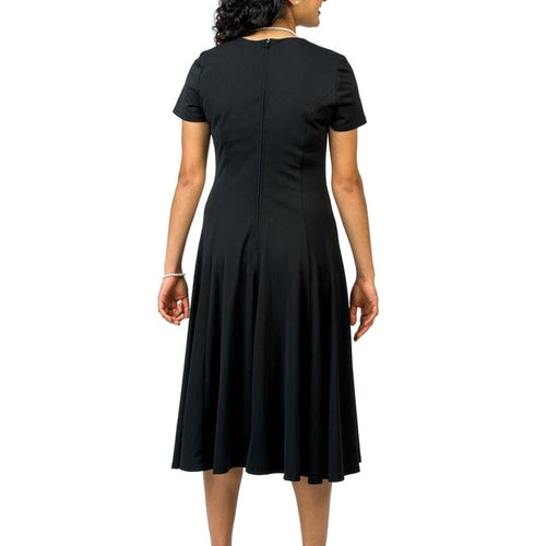 Back view of Valentina Sweetheart Neck Short Sleeve Show Choir Dress in black, featuring a fitted bodice, flowing A-line skirt, and performance-ready design.