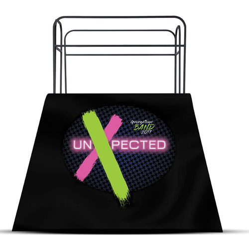 DSI podium skirt with custom printed design featuring “Unexpected” graphic, designed to cover marching band conductor podiums for performances, competitions, and show presentations.