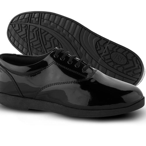 DSI Showstopper Patent marching shoes in glossy black, featuring a high-shine patent leather upper with lace-up closure, low-profile silhouette, cushioned interior, and durable non-slip rubber outsole, designed for marching band, drum corps, and show performances requiring maximum visual impact, stability, and comfort.