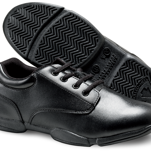 Super Drillmaster marching shoes in black, featuring a polished leather upper with lace-up closure, padded ankle collar, roll-to-heel cushioned outsole with herringbone traction, and durable low-profile design built for marching band and drill team performers requiring stability, comfort, and controlled heel-to-toe movement during field performances and rehearsals.