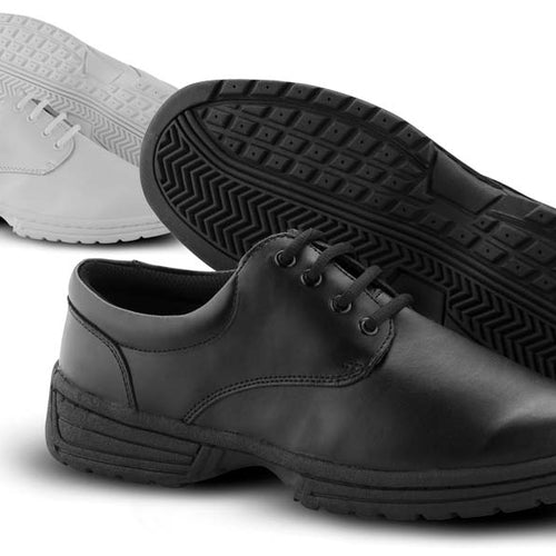 Angled product view of DSI MTX marching shoes in black and white, showcasing a smooth leather upper, lace-up design, cushioned midsole, and high-traction rubber outsole, built for marching band, drum corps, show choir, and long-duration performance stability.