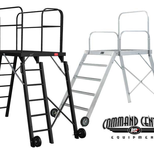 DSI 6-foot Command Center podium shown in black and silver finishes, featuring elevated conductor platform with safety railings, ladder access, wheeled base, and sturdy metal construction for marching band and performance direction.