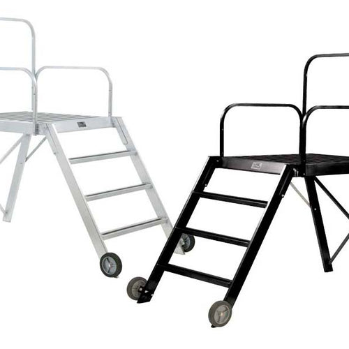 DSI 42-inch conductor podium shown in black and silver finishes, featuring a stable elevated platform with safety handrails, integrated ladder steps, and rolling wheels for easy mobility during band and orchestra performances.