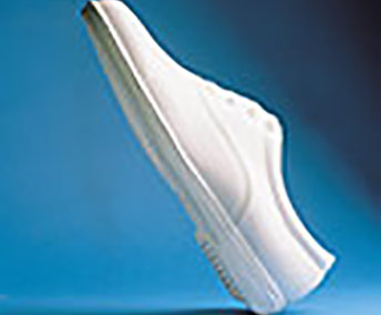Side profile of the Dinkles Vanguard white marching shoe highlighting the streamlined silhouette, reinforced heel construction, and supportive sole design, engineered to promote smooth roll-through, balance, and stability during marching band performances, drills, and parade routines.